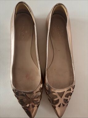 Kate Spade Metallic Rose Gold Flats with laser-cut toe